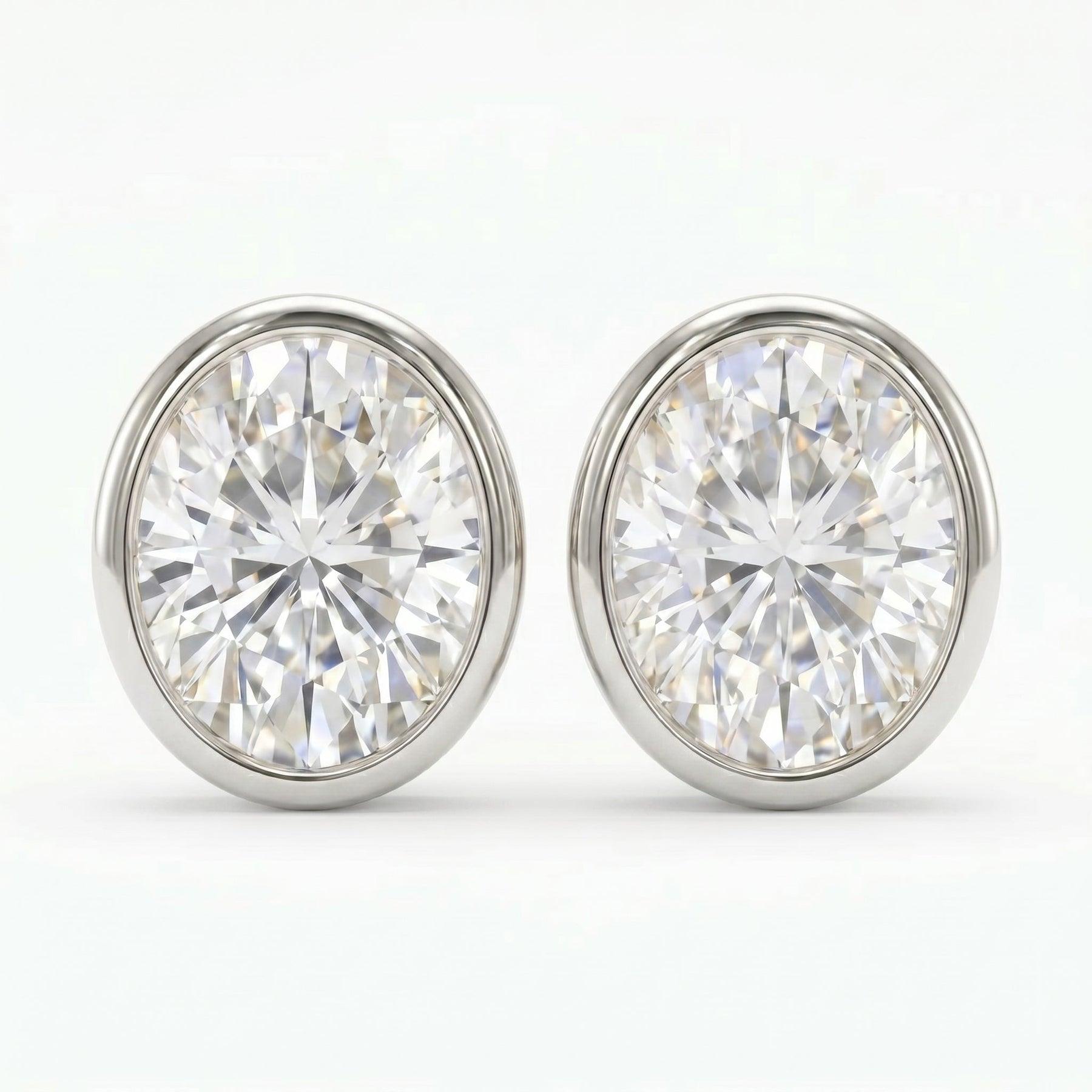 Pair of diamond stud earrings on a white background