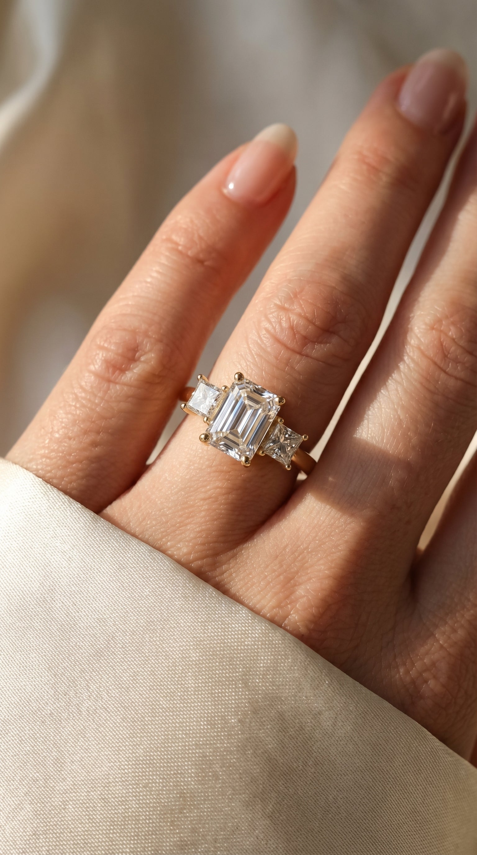 The Axis Trio Emerald Ring
