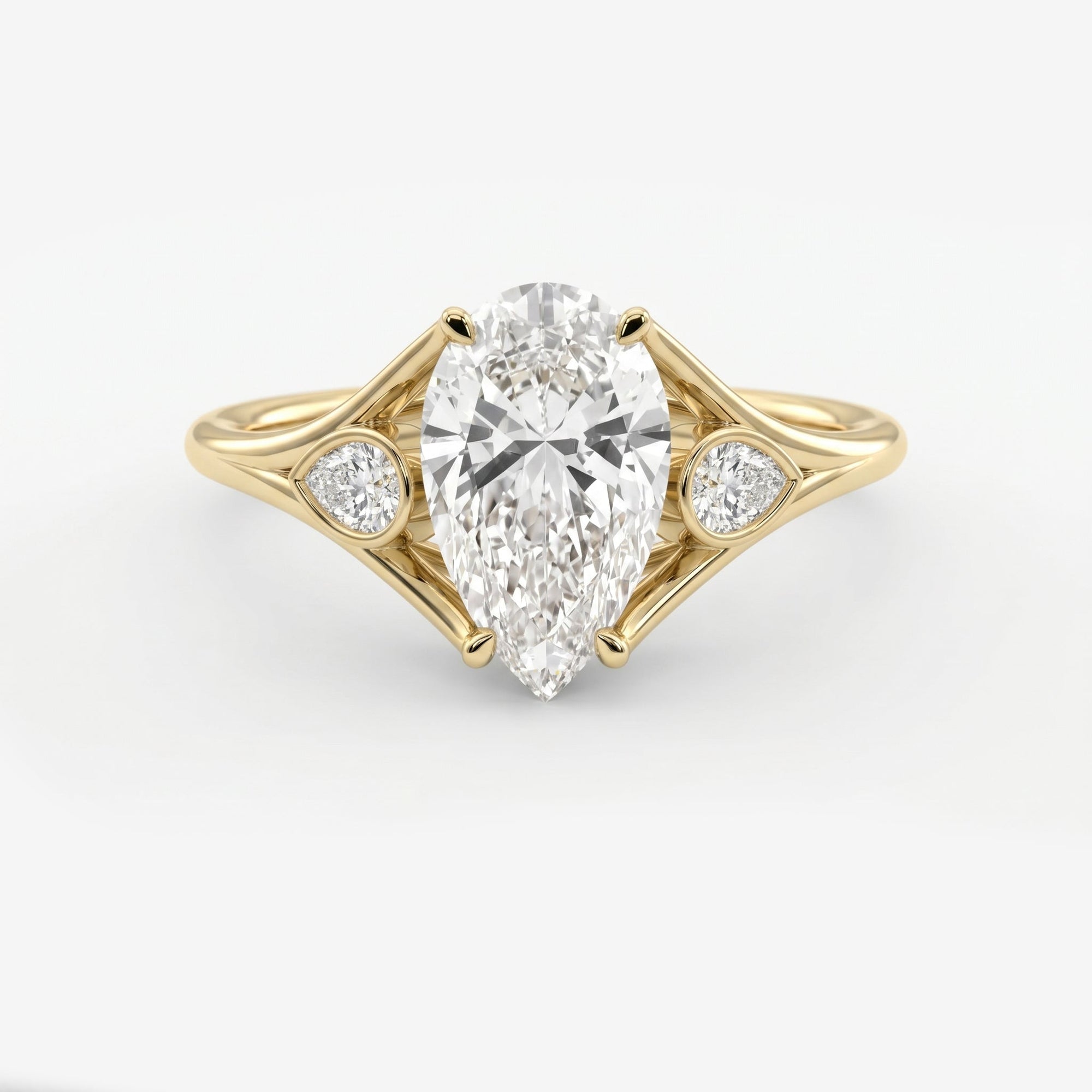 Custom 4‑Prong Diamond Ring with Bezel‑Set Pear Side Stones