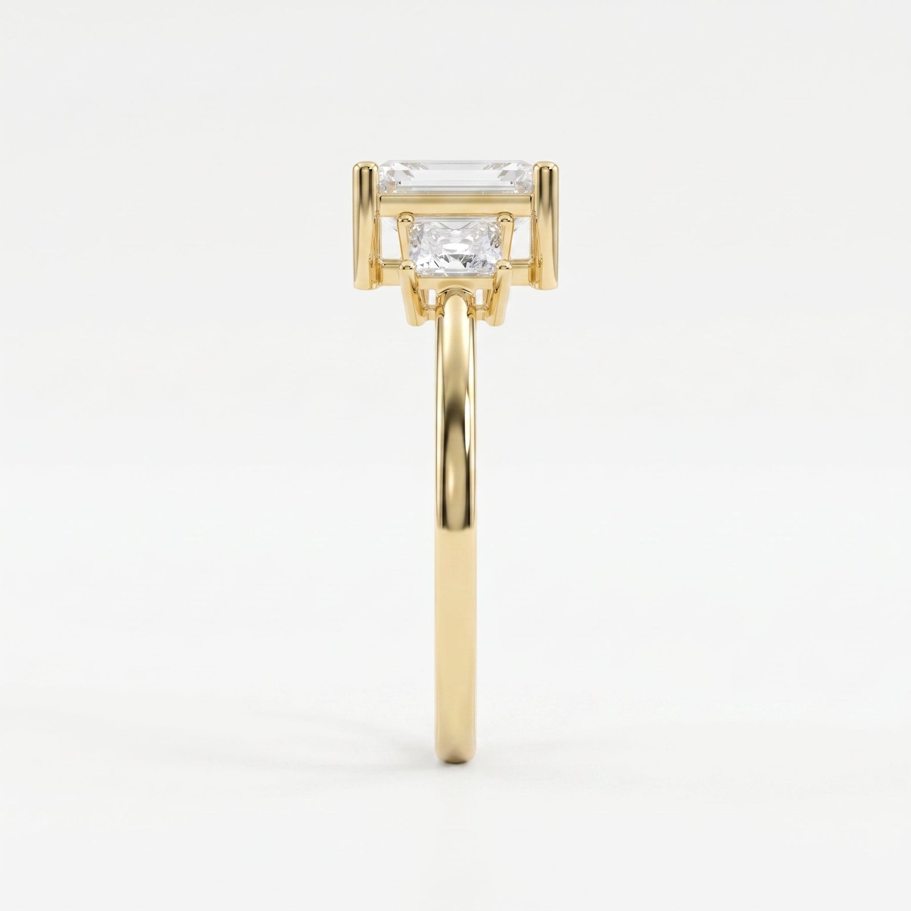 The Axis Trio Emerald Ring
