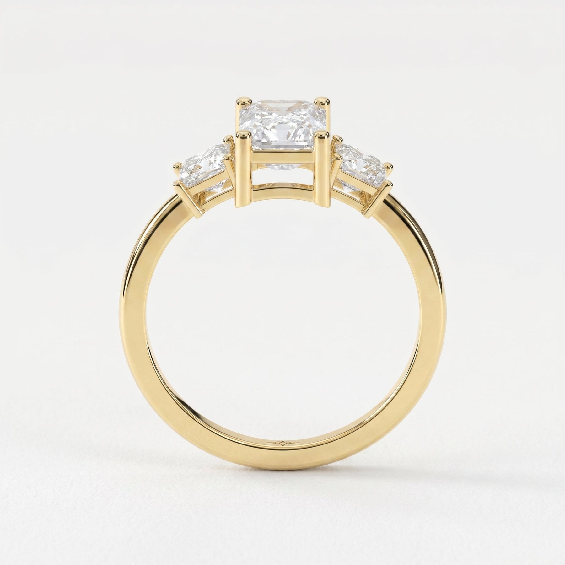 The Axis Trio Emerald Ring