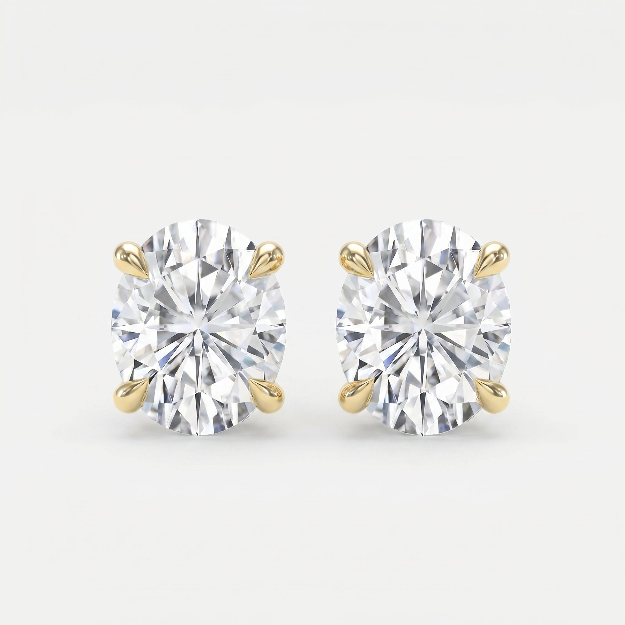 Pair of diamond stud earrings on a light gray background