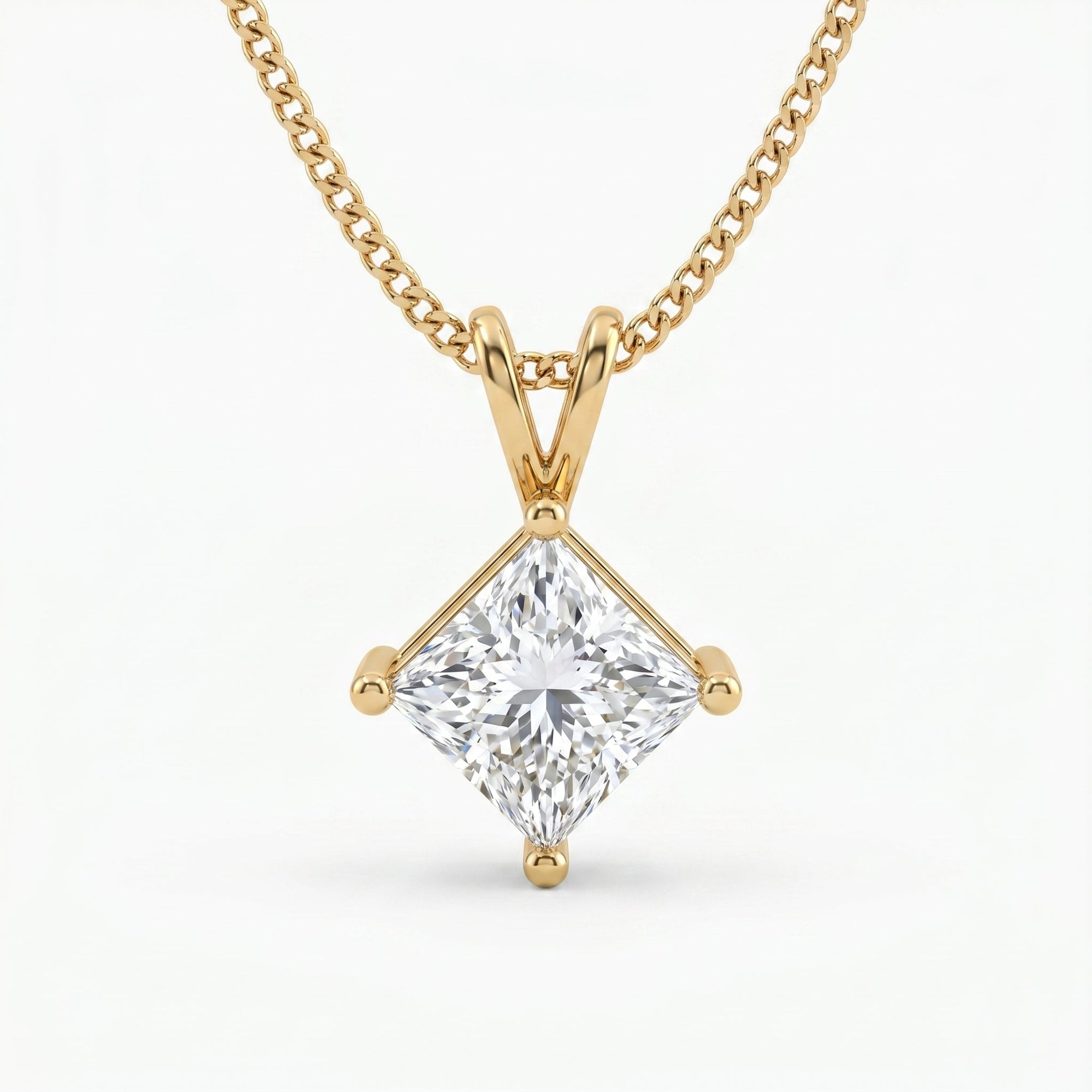 Gold necklace with a diamond pendant on a white background
