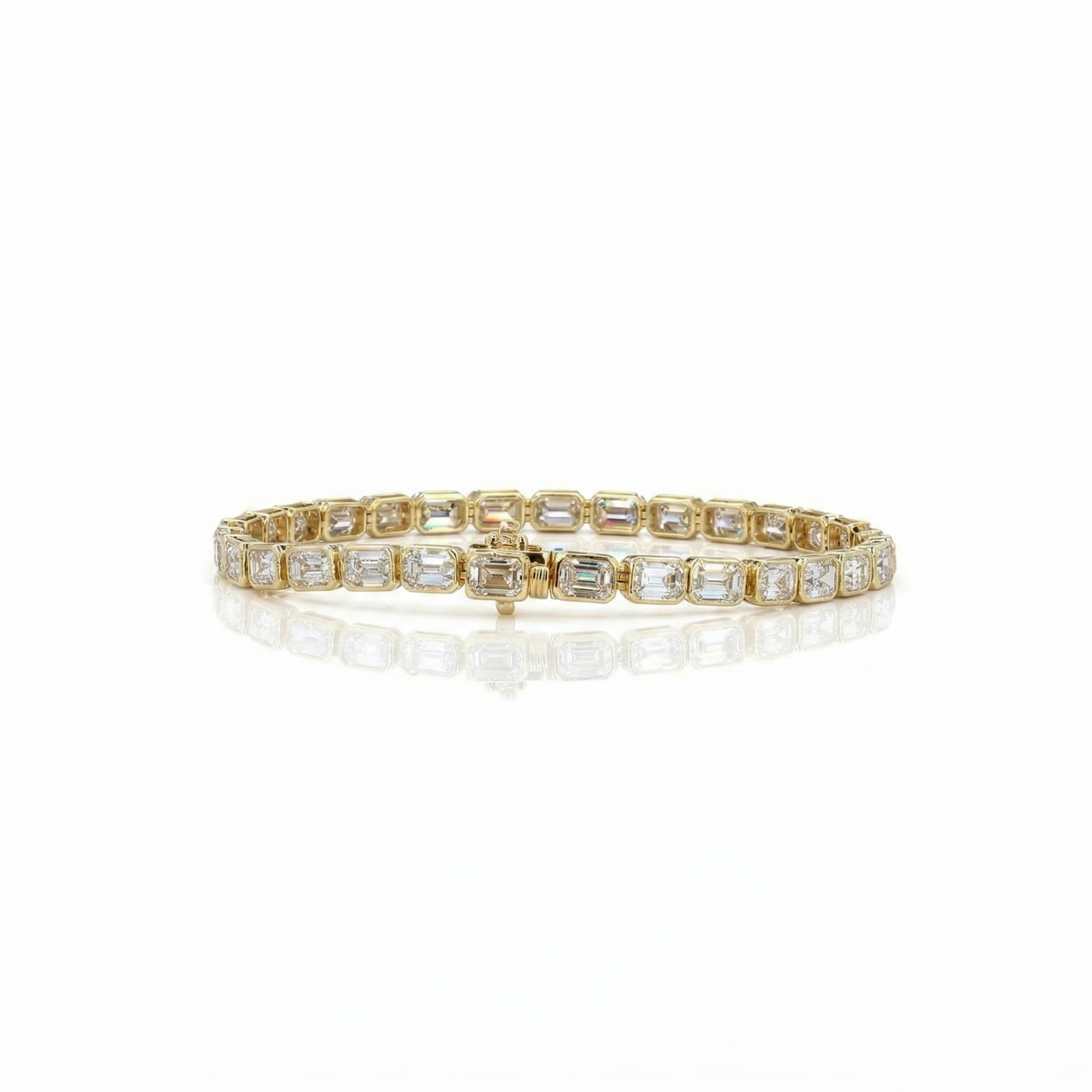Gold bracelet with clear gemstones on a white background