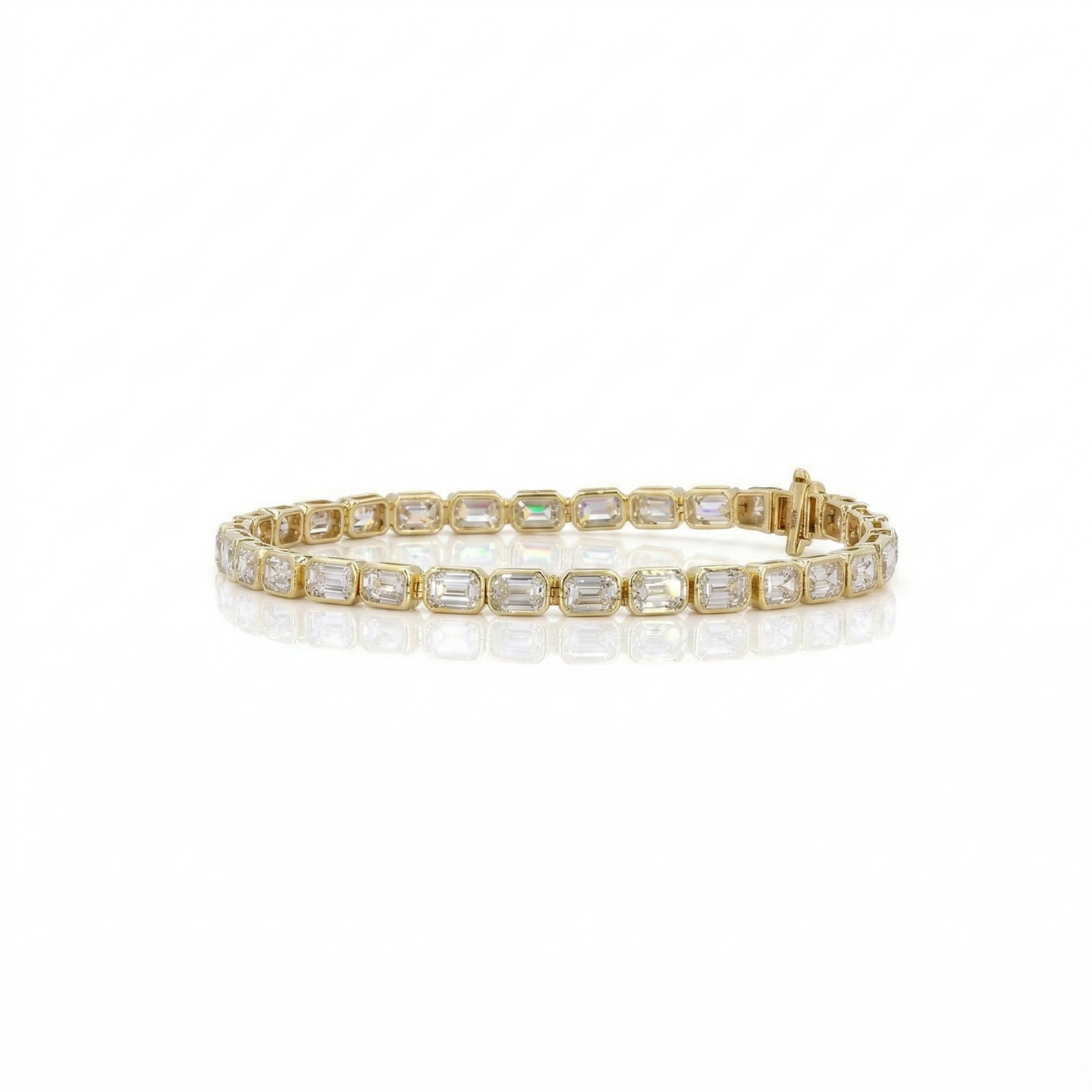 Gold bracelet with clear gemstones on a white background