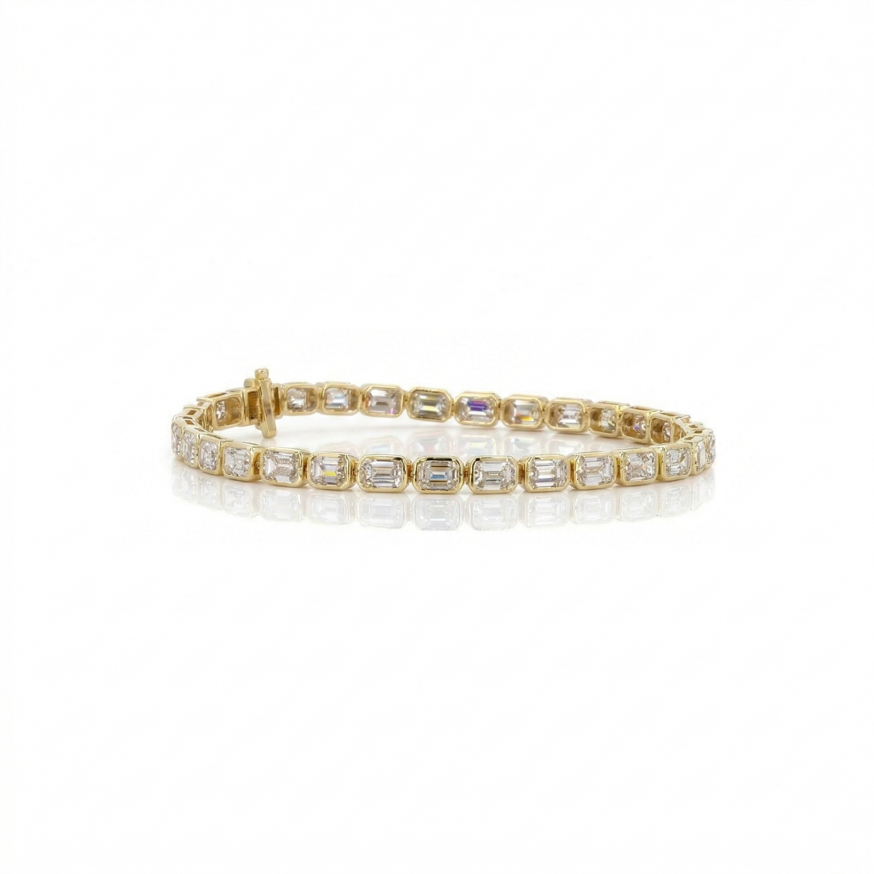 Gold bracelet with clear stones on a white background