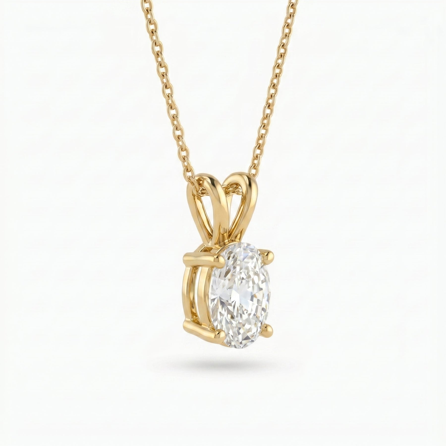 Gold pendant with a diamond on a white background