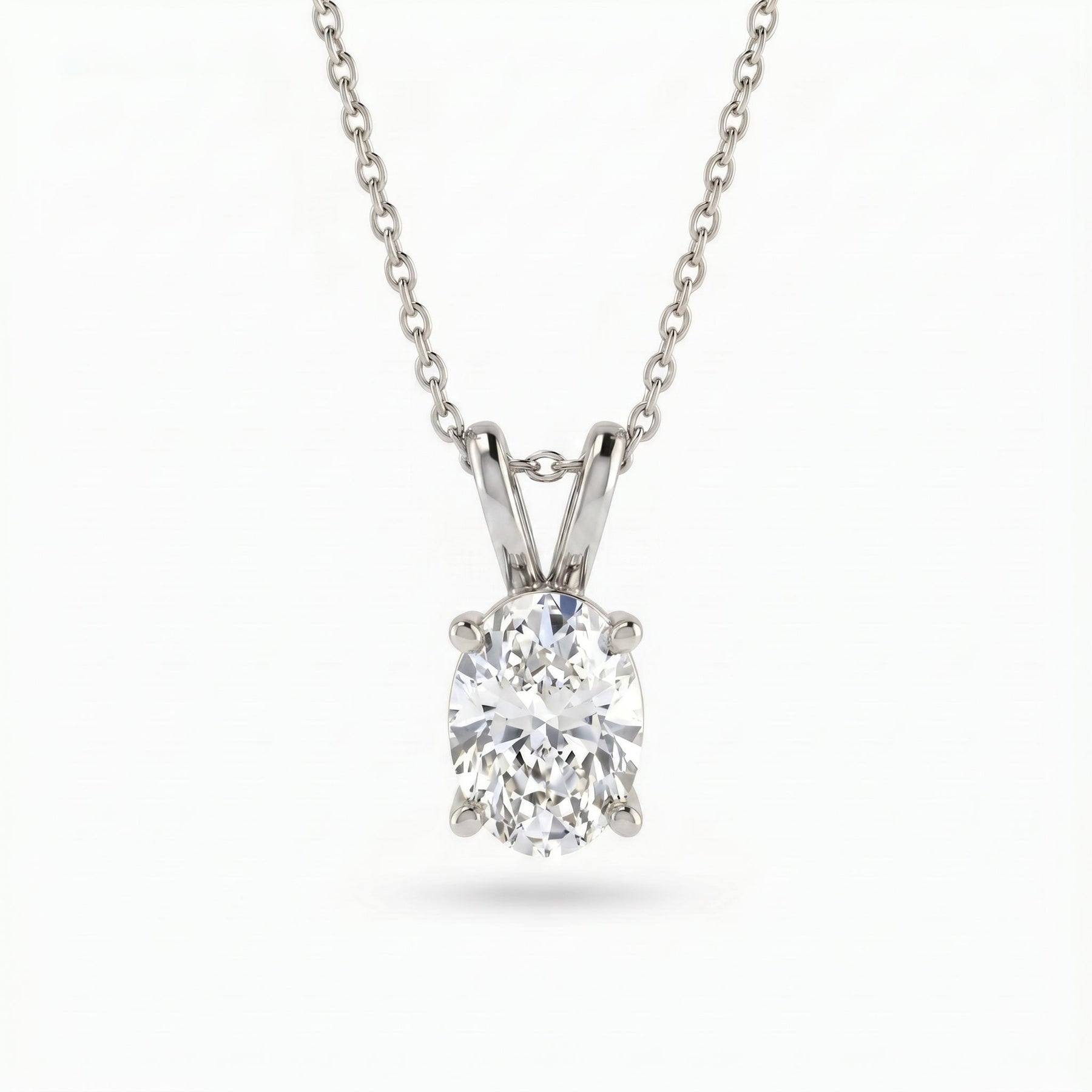 Diamond pendant on a chain against a white background