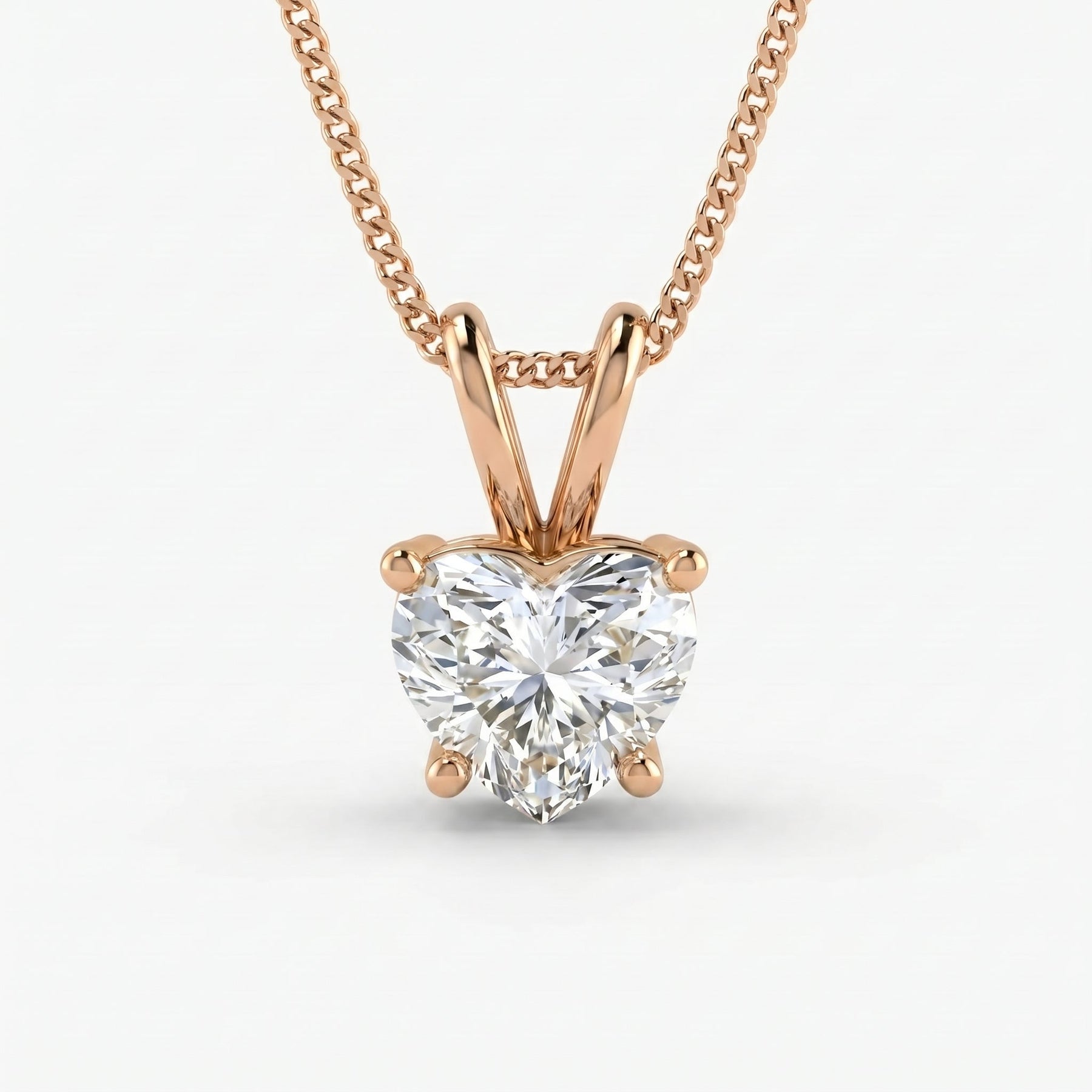 Rose gold necklace with a heart-shaped diamond pendant on a white background