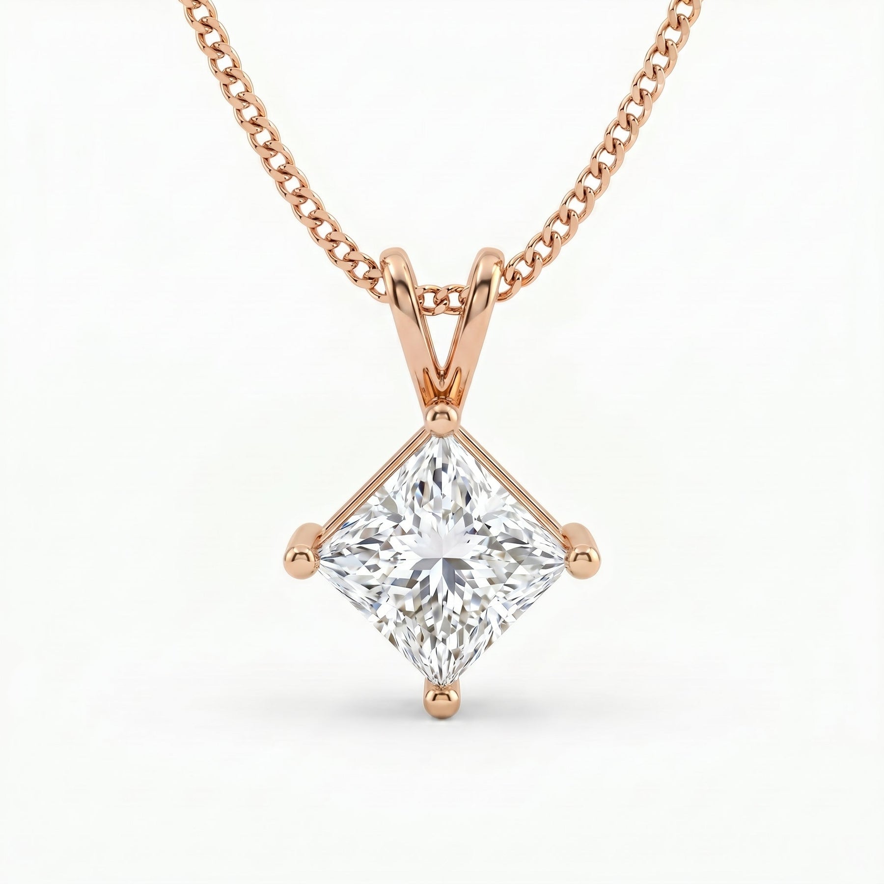 Rose gold necklace with a diamond pendant on a white background