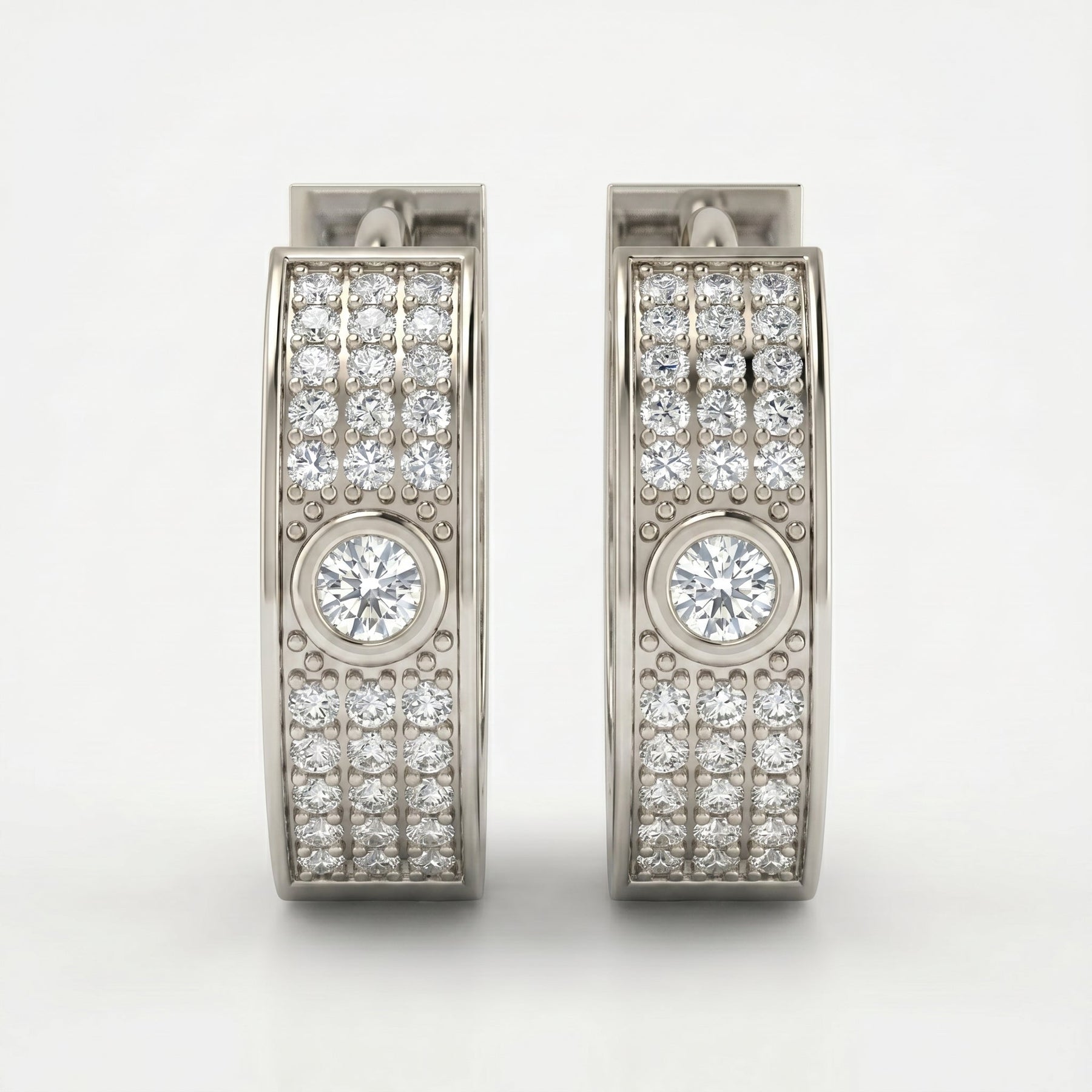 Luxury diamond huggie hoop earrings in rose gold with pavé detailing shown at elegant 45-degree angle