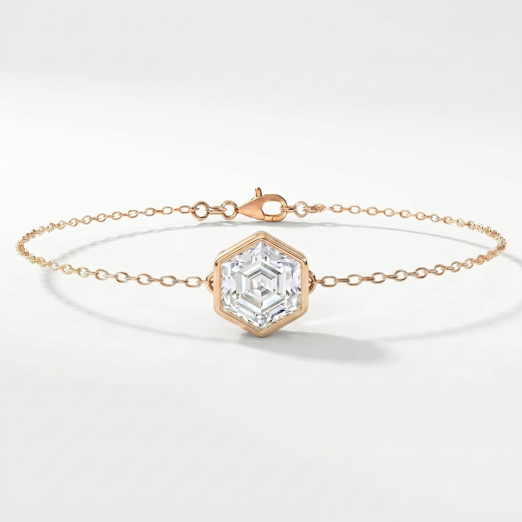 Minimalist hexagon crystal bracelet in rose gold with dainty chain and geometric gemstone centerpiece