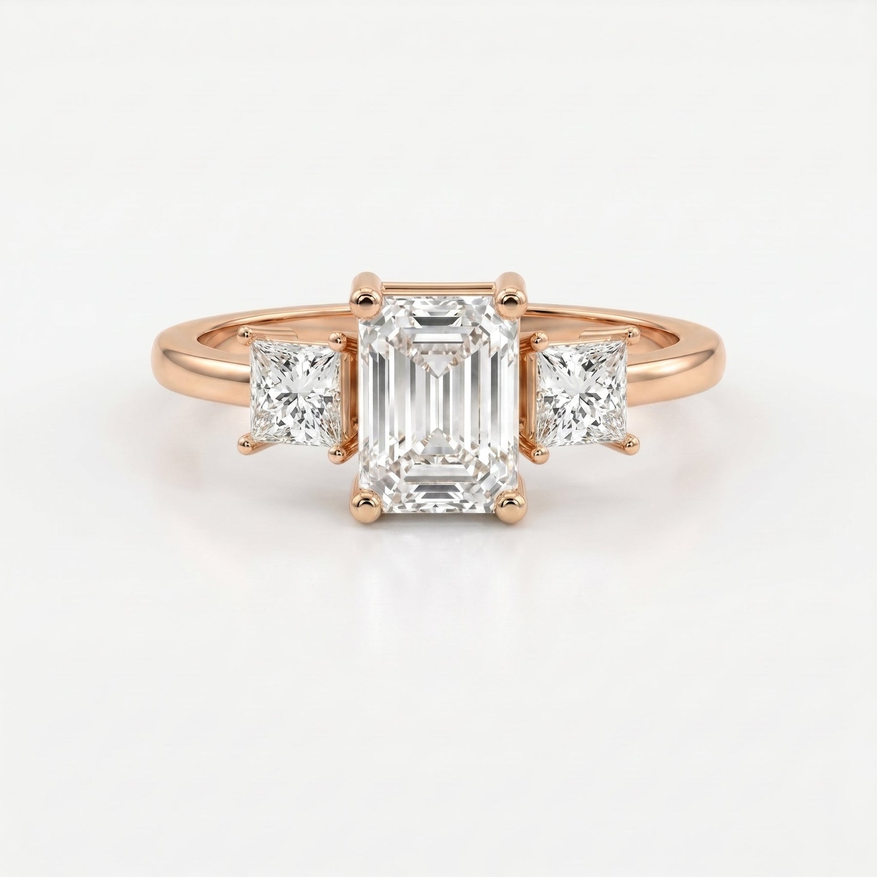 The Axis Trio Emerald Ring