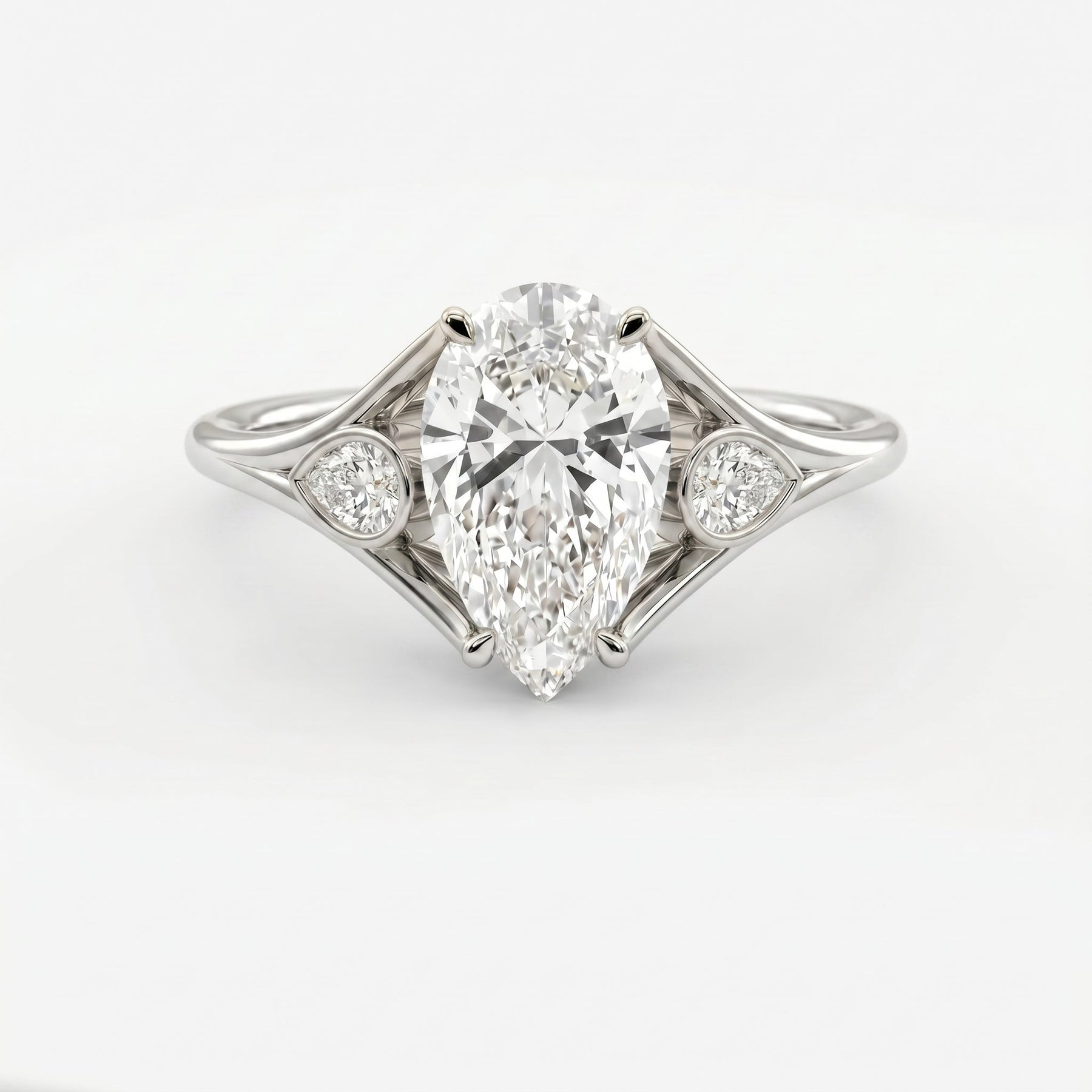 Custom 4‑Prong Diamond Ring with Bezel‑Set Pear Side Stones