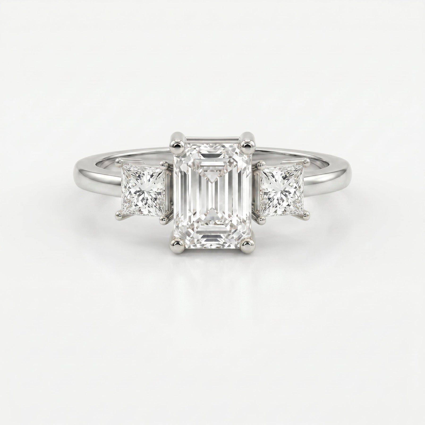 The Axis Trio Emerald Ring