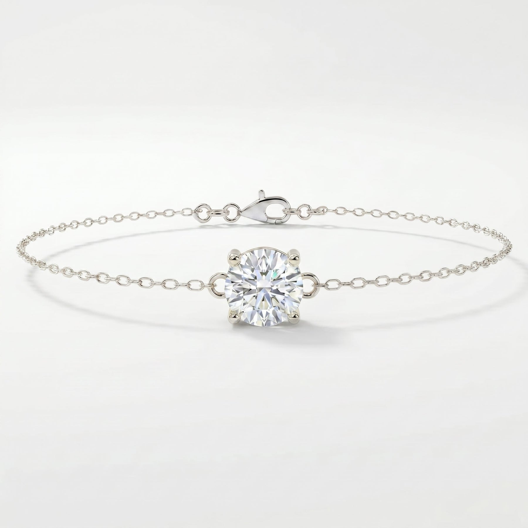 White gold solitaire bracelet with brilliant round gemstone on delicate chain
