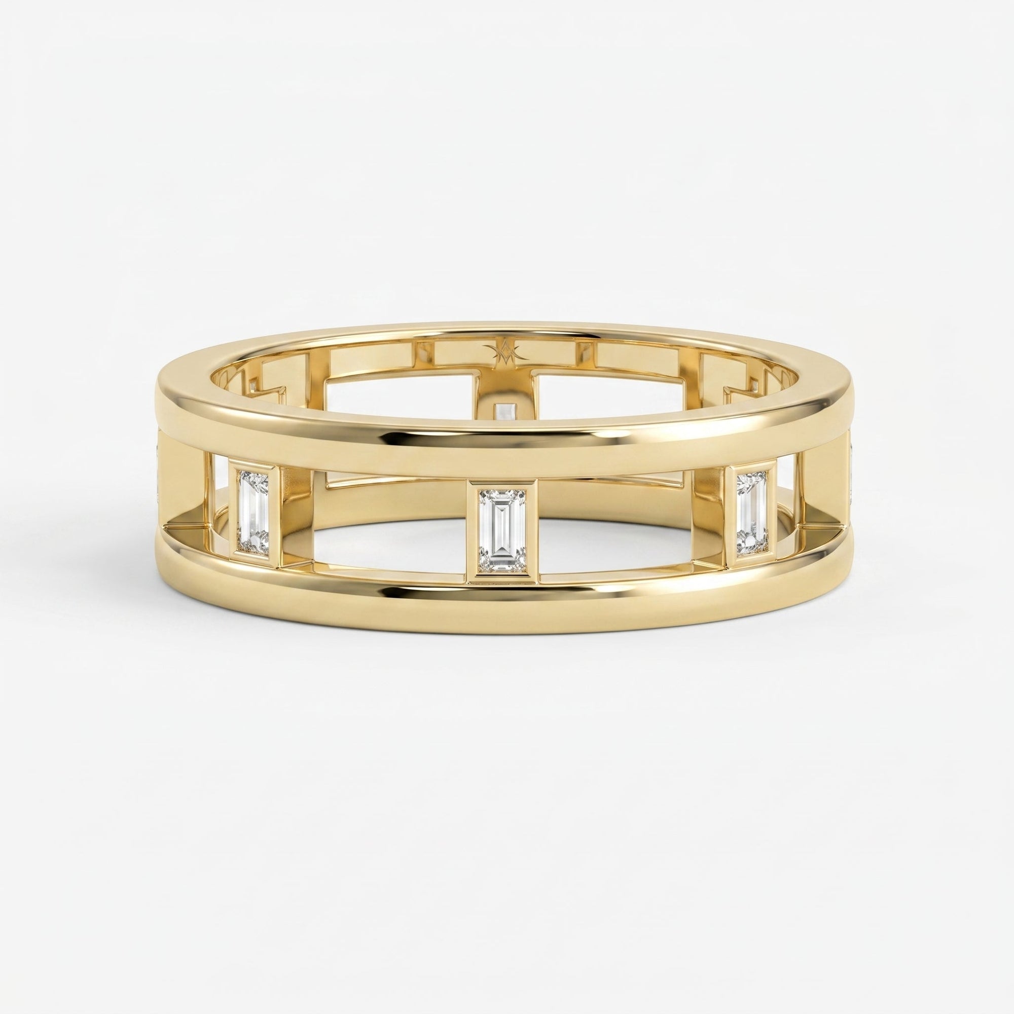 Luxury yellow gold open band ring featuring bezel-set Emerald diamonds and modern geometric architectural design.