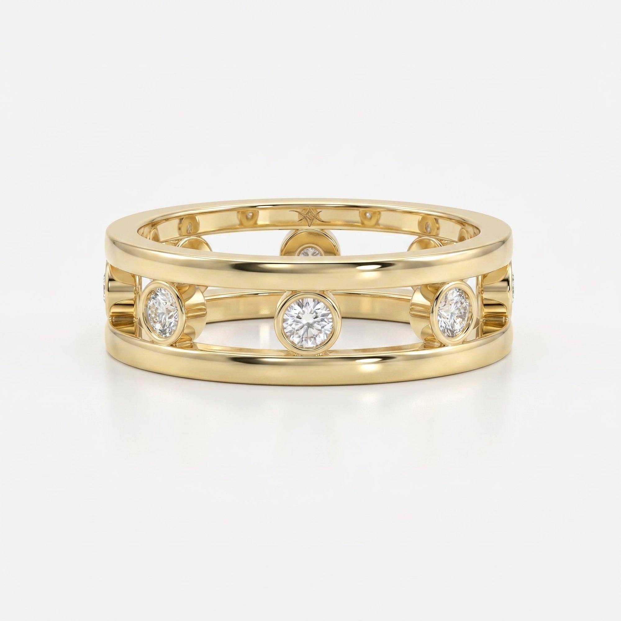 Modern yellow gold open-band diamond ring with bezel-set round diamonds, luxury fine jewelry front view on white background.