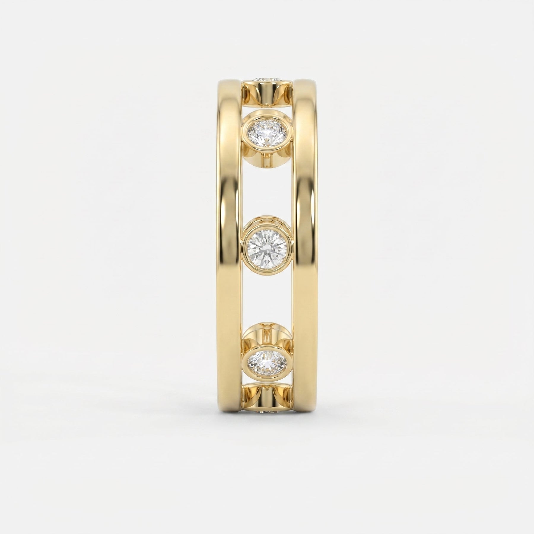 Side profile of yellow gold open-gallery diamond ring highlighting bezel settings and architectural design.