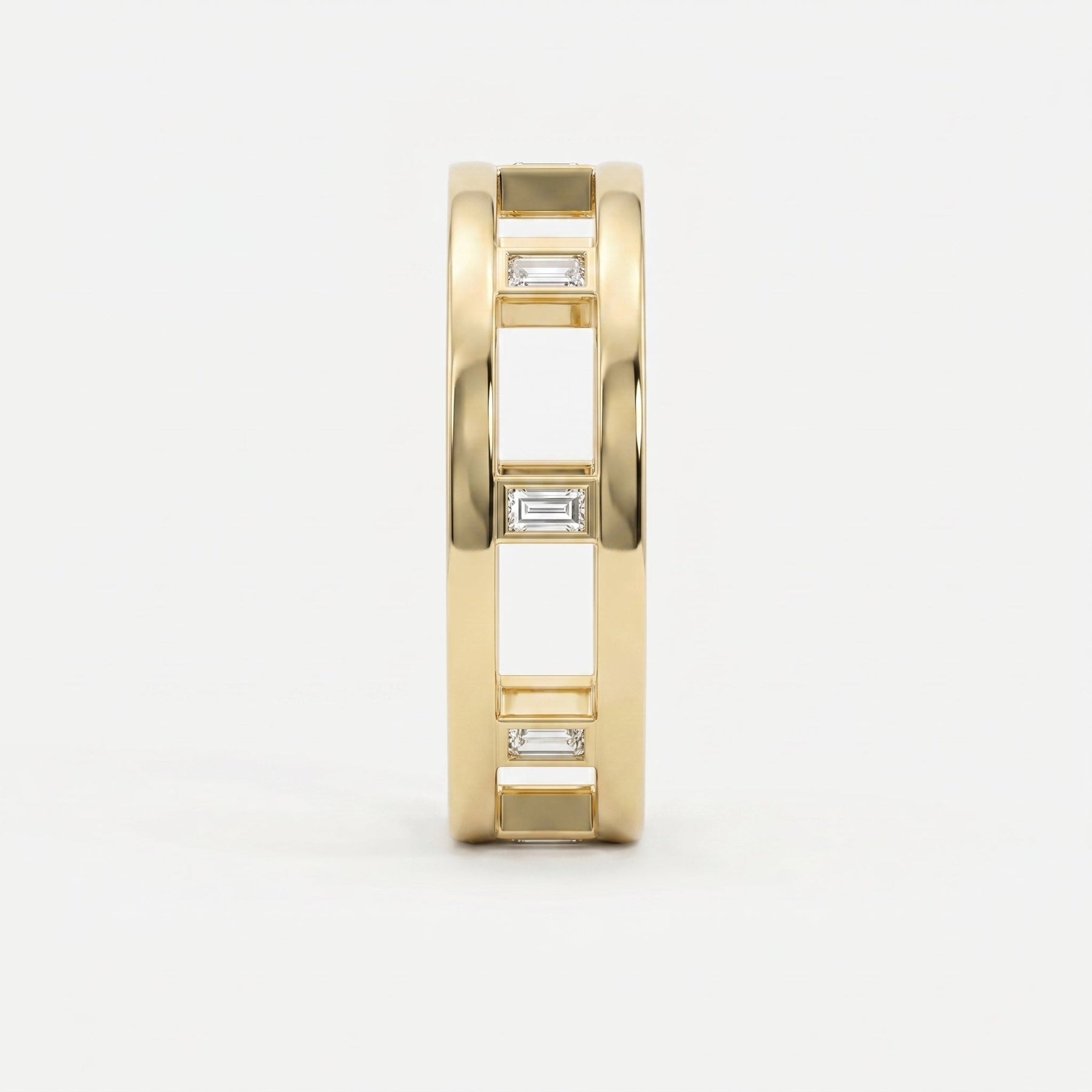 Side profile of yellow gold openwork ring featuring Baguette diamond accents and architectural band design.