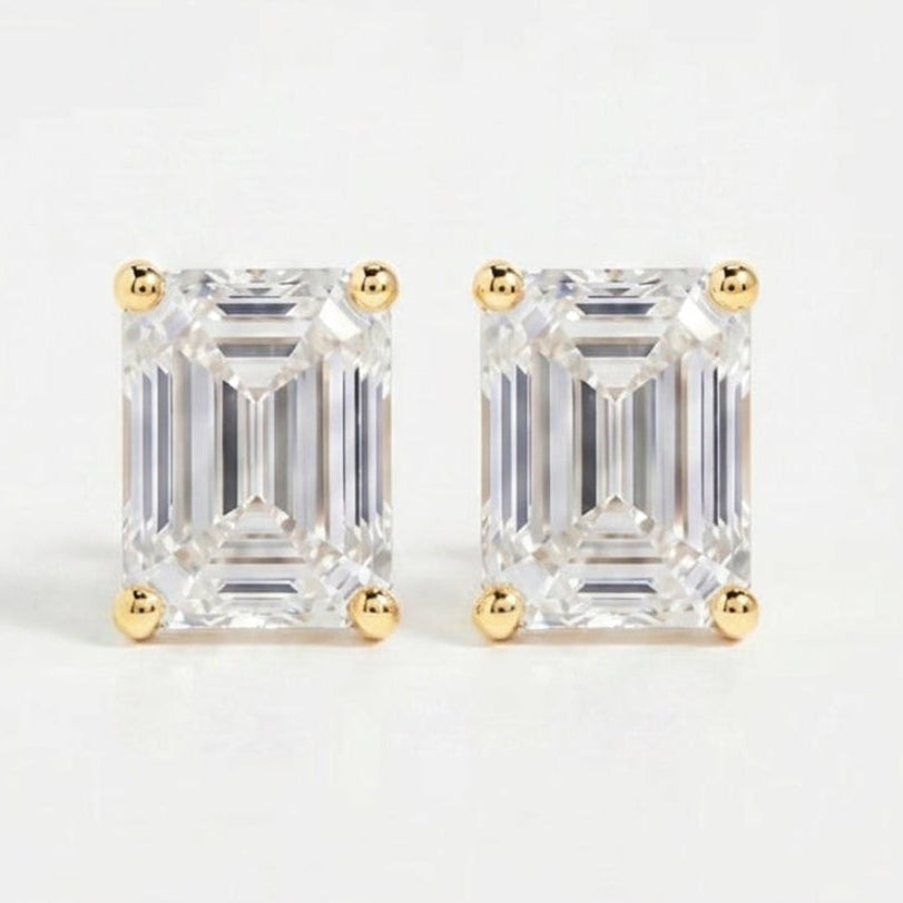 Pair of diamond stud earrings on a light gray background